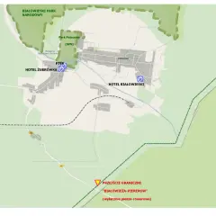Mapa Białowieży z zaznaczonymi atrakcjami: Rezerwat Żubrów, Park Pałacowy, hotele, PTTK. Plan zwiedzania obejmuje też przejście graniczne.