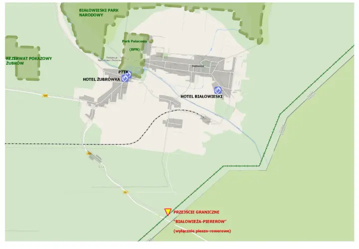 Mapa Białowieży z zaznaczonymi atrakcjami: Rezerwat Żubrów, Park Pałacowy, hotele, PTTK. Plan zwiedzania obejmuje też przejście graniczne.