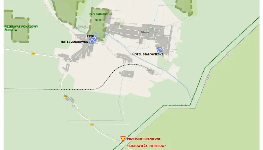 Mapa Białowieży z zaznaczonymi atrakcjami: Rezerwat Żubrów, Park Pałacowy, hotele, PTTK. Plan zwiedzania obejmuje też przejście graniczne.