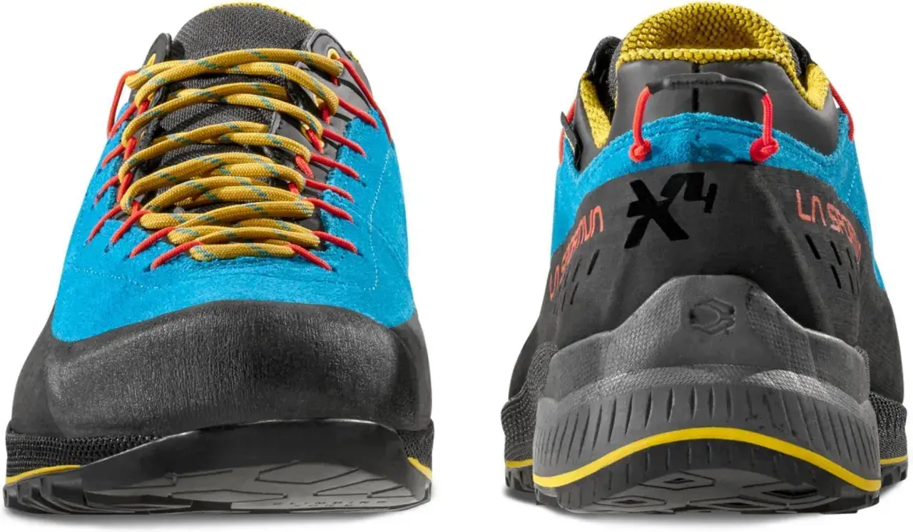 Buty La Sportiva TX4 Evo w kolorze niebieskim z żółtymi sznurówkami i czerwonymi akcentami. Idealne na górskie wędrówki.